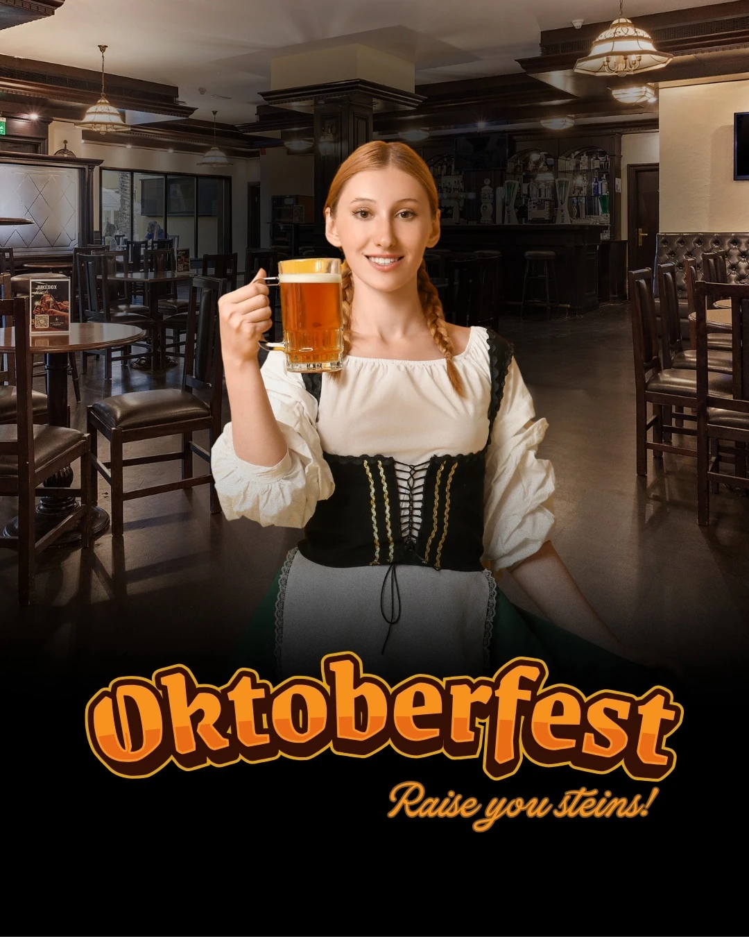 A young woman with a braided red hairstyle wearing a black and cream dirndl holds up a full glass mug of beer inside a dimly lit pub with wooden tables and chairs, with orange Oktoberfest text and the phrase raise you steins below.